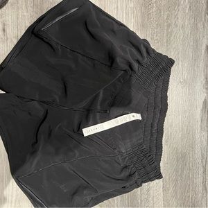 Lululemon hotty hot shorts 
Black
Size 4
High rise 
Long 4 inch inseam